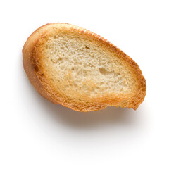 Toasted baguette slice isolated on white background close up.  Toast, crouton.   Top view.