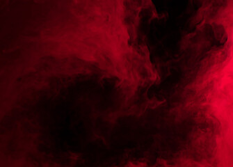 Abstract background of chaotically mixing puffs of red smoke on a dark background