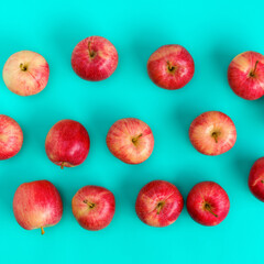 Fruit pattern of red apple on blue background. Flat lay, top view. Pop art design, creative summer concept. Food background.