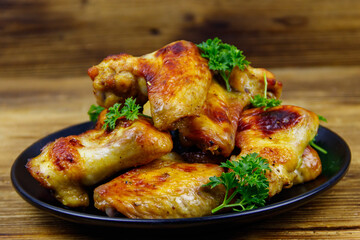 Baked chicken wings on a wooden table