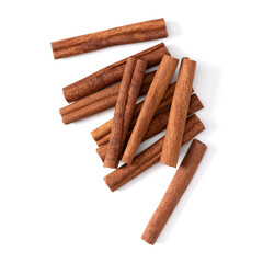 Cinnamon sticks isolated on white background closeup. Canella spice. Aromatic condiment background. Flat lay, top view.