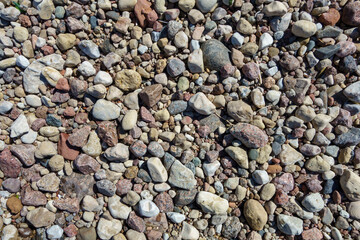Gravel on the seashore structured natural background.