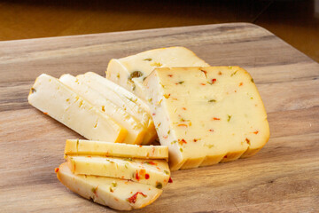 Soft cheese with olives and cheese with chili peppers with tomatoes and rosemary – wood