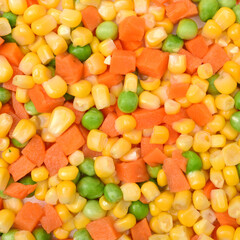 Mix of vegetable containing carrots, peas, and corn  background