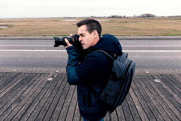 Man taking photos in the field