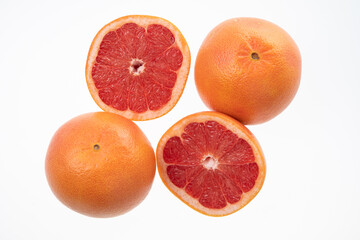 Sliced juicy grapefruits isolated on white
