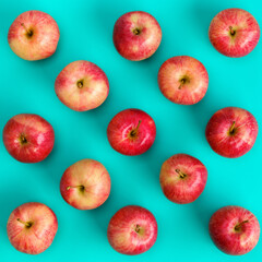 Fruit pattern of red apple on blue background. Flat lay, top view. Pop art design, creative summer concept. Food background.