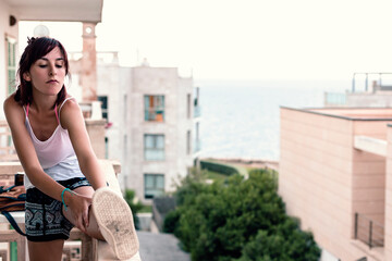 Woman stretching on terrace