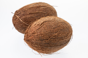 Two coconuts isolated on white background