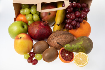 Fresh fruits from market falling out of a paper bag
