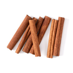 Cinnamon sticks isolated on white background closeup. Canella spice. Aromatic condiment background. Flat lay, top view.