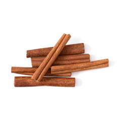 Cinnamon sticks isolated over white background closeup. Canella spice. Aromatic condiment background. Flat lay, top view.