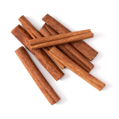 Cinnamon sticks isolated over white background closeup. Canella spice. Aromatic condiment background. Flat lay, top view.