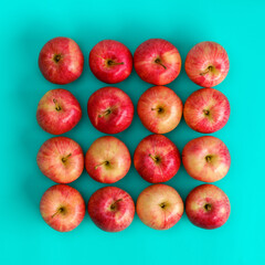 Fruit pattern of red apple on blue background. Flat lay, top view. Pop art design, creative summer concept. Food background. .