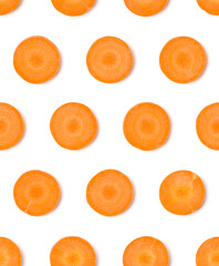 Creative layout made of carrot slices. Flat lay, top view. Vegetables isolated on white background. Food ingredient seamless pattern...
