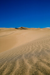 Sand dunes agains the blue sky. Nature landscape. National park, Great Sand Dunes Colorado