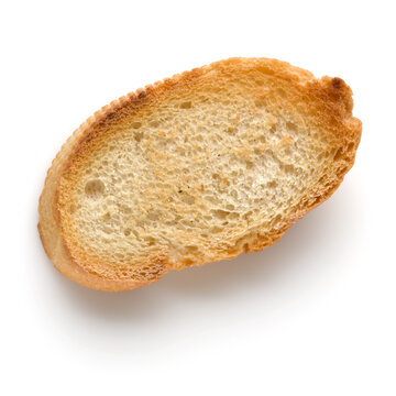 Toasted baguette slice isolated over white background close up.  Toast, crouton.   Top view..