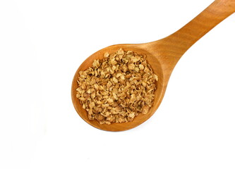 Buckwheat flakes in a wooden spoon isolated on white background. Healthy buckwheat flakes. Healthy food.