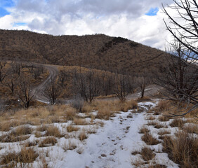 Snowy Hiking Trail views towards Lake Mountains Peak via Israel Canyon road towards Radio Towers in winter, Utah Lake, Wasatch Front Rocky Mountains, Provo, United States.