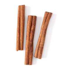 Cinnamon sticks isolated over white background closeup. Canella spice. Aromatic condiment background. Flat lay, top view..