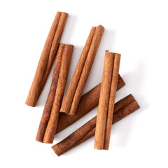 Cinnamon sticks isolated over white background closeup. Canella spice. Aromatic condiment background. Flat lay, top view..