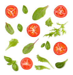 Creative layout made of tomato slices and lettuce salad leaves. Flat lay, top view. Food concept. Vegetables isolated on white background. Food ingredients pattern.