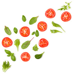 Creative layout made of tomato slices and lettuce salad leaves. Flat lay, top view. Food concept. Vegetables isolated on white background. Food ingredients pattern.