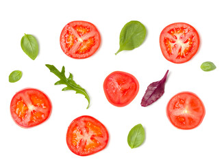 Creative layout made of tomato slices and lettuce salad leaves. Flat lay, top view. Food concept. Vegetables isolated on white background. Food ingredients pattern.