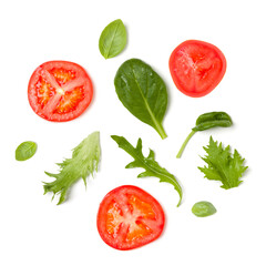 Creative layout made of tomato slices and lettuce salad leaves. Flat lay, top view. Food concept. Vegetables isolated on white background. Food ingredients pattern.