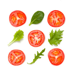 Creative layout made of tomato slices and lettuce salad leaves. Flat lay, top view. Food concept. Vegetables isolated on white background. Food ingredients seamless pattern.