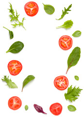 Creative layout made of tomato slices and lettuce salad leaves. Flat lay, top view. Food concept. Vegetables isolated on white background. Food ingredients pattern with copy space.