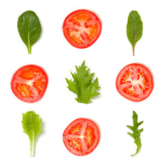 Creative layout made of tomato slices and lettuce salad leaves. Flat lay, top view. Food concept. Vegetables isolated on white background. Food ingredients seamless pattern.