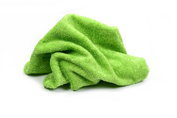 Green micro fiber towel isolated on white background. Clean, new green microfiber cloth isolated on...