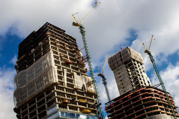 View of crane and workers in the building site construction in Sao Paulo city, Brazil