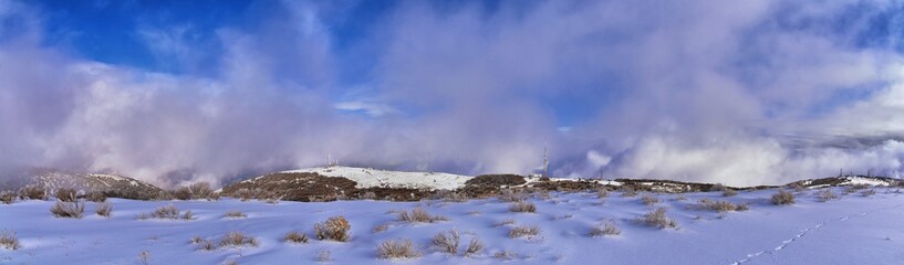 Radio Towers on Lake Mountains Peak via Israel Canyon road in winter, Utah Lake, Wasatch Front Rocky Mountains, Provo, United States.