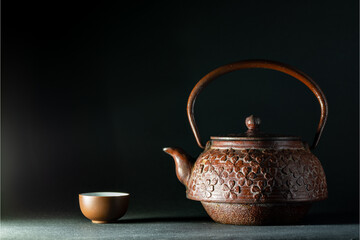 Japanese iron kettle and small tea cup