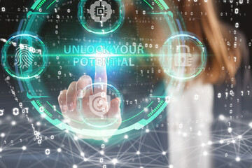 Fototapeta premium Business, Technology, Internet and network concept. Young businessman working on a virtual screen of the future and sees the inscription: Unlock your potential