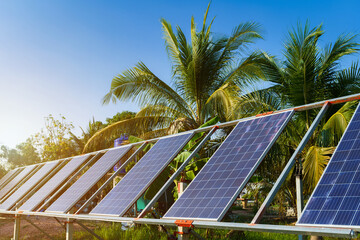 power solar panel for agriculture in a rural houses area Agricultural fields blue sky background,Agro-industry of household Rural style in Thailand, smart farm alternative clean green energy concept
