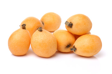 Close up view of some loquat fruit isolated on a white background 