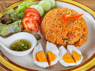 Fried rice with sweet chili sauce crispy slid fish and salted egg. Close-up photo