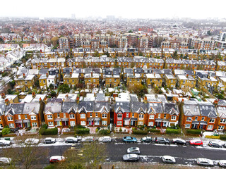 Aerial view of snowy London suburb in winter