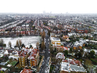 Aerial view of snowy London suburb in winter