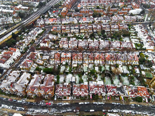 Aerial view of snowy London suburb in winter