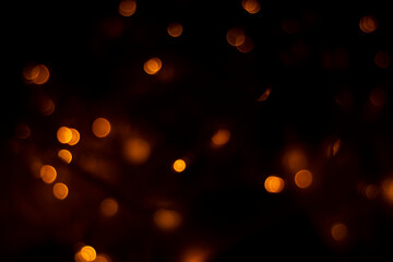 Abstract dark orange dots black background for texture	