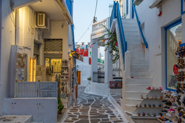 Tourist shops at a narrow street in the old town of Mykonos, Greece