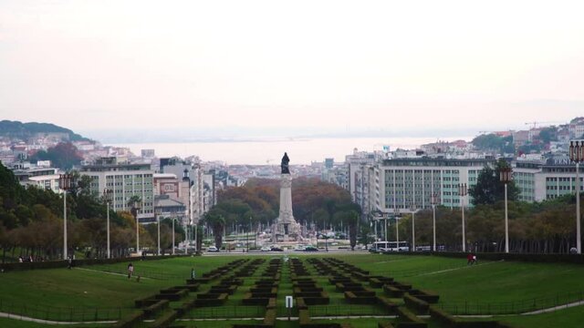 View of park (Parque Eduardo VII) with statue, city and river in background
