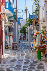 Tourist shops at a narrow street in the old town of Mykonos, Greece