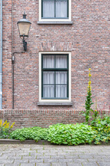 old brick wall with window and light