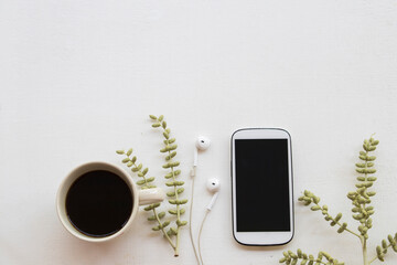 mobile phone with hot coffee for relaxation arrangement flat lay style on background white