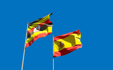 Flags of Uganda and Spain.